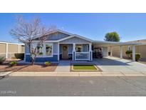 Charming single-story home with covered parking, landscaped yard, and welcoming front porch at 2263 N Trekell Rd # 21, Casa Grande, AZ 85122