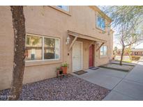 Charming townhome featuring a well-maintained facade with a secure front entry and desert landscaping at 2277 S Apache Dr # 7, Apache Junction, AZ 85120