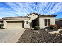 Charming single-story home with a well-manicured front yard and desert landscaping at 5405 S Marigold Way, Gilbert, AZ 85298