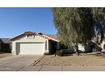 Charming single-story home with a well-maintained front yard and two-car garage at 10322 W Reade Ave, Glendale, AZ 85307