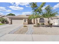 Charming single-story home featuring a well-maintained front yard and attached two-car garage at 108 N Pioneer St, Gilbert, AZ 85233