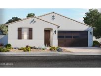 Charming single-story home with a brown garage door, desert landscaping, and a white exterior at 24493 W Grenadine Rd, Buckeye, AZ 85326