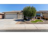 Charming single-story home with a spacious three-car garage and desert landscaping at 3025 S Copperwood --, Mesa, AZ 85212