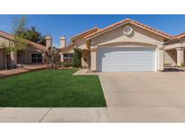 Charming single-story home with a well-manicured lawn and a two-car garage at 6834 S Dennis Dr, Tempe, AZ 85283