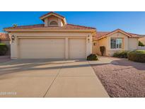 Charming single-story home featuring a terracotta roof, and a spacious three-car garage, perfect for storage at 10901 E Sunnydale Dr, Sun Lakes, AZ 85248