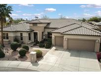 Charming single-story home with a well-manicured front yard and a spacious three-car garage at 16769 W Brookhaven Ct, Surprise, AZ 85387