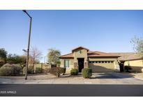 Charming single-story home featuring a desert landscape, tile roof, and inviting front entrance at 29902 N 71St Ave, Peoria, AZ 85383