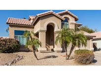 Inviting single-Gathering home boasting an arched entrance and a well-manicured desert landscape at 4502 E Meadow Dr, Phoenix, AZ 85032