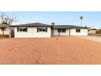 Charming single-story home featuring a well-maintained exterior and minimalist xeriscaped front yard at 556 E Manor Dr, Casa Grande, AZ 85122