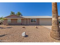 Charming single-story home featuring desert landscaping and a two-car garage at 13232 N 40Th Pl, Phoenix, AZ 85032