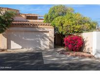 Charming home featuring an attached garage, mature landscaping, and a welcoming desert aesthetic at 1920 E Maryland Ave # 16, Phoenix, AZ 85016