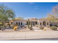 Elegant single-story home featuring desert landscaping and a barrel tile roof at 22970 N 79Th Pl, Scottsdale, AZ 85255