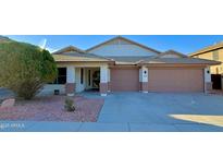 Charming single-story home features a well-manicured yard and a two-car garage at 3129 W Walter Way, Phoenix, AZ 85027