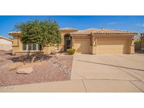 Charming single-story home featuring a neutral color palette, desert landscaping, and a two-car garage at 3350 W Ivanhoe Ct, Chandler, AZ 85226