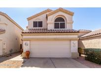 Inviting two-story home with a well-maintained front yard and neutral exterior paint at 3435 E Renee Dr, Phoenix, AZ 85050