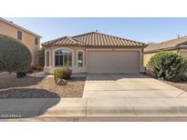 Charming single-story home with a tile roof, desert landscaping, and a two-car garage at 3967 E Hematite Ln, San Tan Valley, AZ 85143