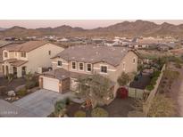 Stunning two-story home with a three-car garage and a well-manicured yard nestled against picturesque mountain views at 43805 N Ericson Ln, New River, AZ 85087