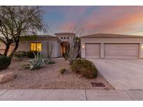 Charming single-story home showcasing a beautifully xeriscaped front yard and a spacious three-car garage at 4546 E Sierra Sunset Trl, Cave Creek, AZ 85331