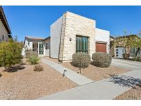 Stunning single story home showcasing a stone facade with low maintenance desert landscaping at 942 E Paseo Way, Phoenix, AZ 85042