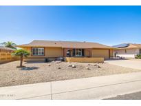 Charming single-story home with desert landscaping and a well-maintained exterior at 9513 W Cottonwood Dr, Sun City, AZ 85373