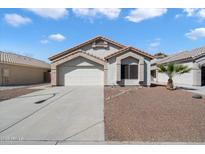 Charming single story home with well maintained desert landscaping, paver accents and tile roof at 14610 N 87Th Ave, Peoria, AZ 85381