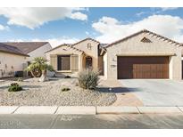 Charming single-story home with a stucco exterior, tile roof, and desert landscaping at 16372 W Mulberry Dr, Goodyear, AZ 85395