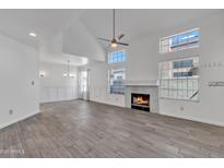 Bright, open living room with fireplace and ample natural light from the many windows at 1822 S 39Th St # 17, Mesa, AZ 85206