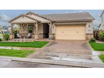Charming single-story home with a cozy front porch and a well-manicured lawn at 3563 E Austin Dr, Gilbert, AZ 85296
