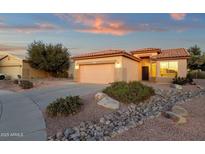 Charming single-Gathering home with a well-maintained front yard and a two-car garage at 4937 S Peach Willow Ln, Gilbert, AZ 85298