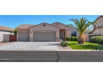 Charming single-story home with a well-maintained front yard, three-car garage and desert landscaping at 866 W Hereford Dr, San Tan Valley, AZ 85143