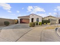 Charming single-story home featuring a well-manicured front yard and a two-car garage at 9646 E Tahoe Cir, Mesa, AZ 85212