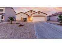 Charming single-story home with a two car garage and desert landscaping at 2225 E Andalusian Loop, San Tan Valley, AZ 85140