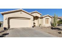 Charming single-story home with neutral stucco and tile roof, complemented by desert landscaping and a two-car garage at 24822 S Sedona Dr, Sun Lakes, AZ 85248