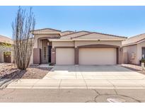 Charming home with well-maintained landscaping and a spacious three-car garage at 4245 E Maya Way, Cave Creek, AZ 85331