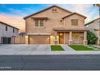 Charming two-story home with a well-maintained lawn, two car garage, and inviting front porch at 12118 W Villa Chula Ct, Sun City, AZ 85373