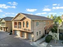 Charming three-story townhome featuring a private balcony and attached garages at 2150 E Bell Rd # 1134, Phoenix, AZ 85022