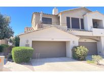 Inviting two-story townhome featuring a private garage and a charming balcony, number 21, enhancing curb appeal at 3131 E Legacy Dr # 2105, Phoenix, AZ 85042