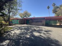 Charming home featuring unique architectural details and a spacious, paved driveway at 6528 N Hillside Dr, Paradise Valley, AZ 85253