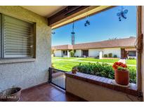 Charming patio with a view of the well-maintained green lawn and surrounding buildings at 8101 N 107Th Ave # 23, Peoria, AZ 85345