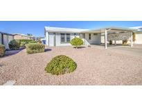 Charming single-story home with desert landscaping and a covered carport at 8500 E Southern Ave # 463, Mesa, AZ 85209