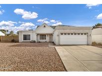 Charming single-story home with a well-maintained front yard and attached two-car garage at 949 E Piute Ave, Phoenix, AZ 85024