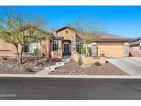 Charming single-story home featuring a landscaped front yard and a welcoming front entrance at 1320 W Whitman Dr, Anthem, AZ 85086