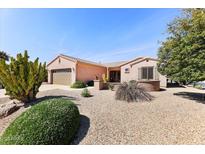 Charming single-story home featuring desert landscaping and a welcoming facade at 17204 W Cordova Ct, Surprise, AZ 85387