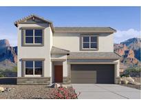 Inviting two-story home featuring a neutral color palette and an attached two-car garage in a picturesque setting at 1828 W Sombra Ave, Apache Junction, AZ 85120