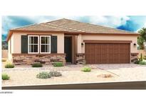 Charming single-story home with stone accents, desert landscaping, and a two-car garage at 2697 N 195Th Dr, Buckeye, AZ 85396