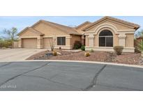Beautiful property features a desert landscape, rock beds, and a three car garage at 5210 E Calle De Baca --, Cave Creek, AZ 85331