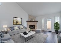Cozy living room featuring a stone fireplace and comfortable seating at 6223 N 12Th St # 8, Phoenix, AZ 85014