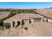 Inviting single-story home boasting desert landscaping, tiled roof, and mountain views at 7576 W Quail Ave, Glendale, AZ 85308