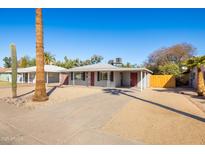 Charming single-story home featuring mature landscaping and a well-maintained gravel yard at 1404 E Hall St, Tempe, AZ 85281