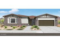 Charming single-story home with stone accents, a two car garage, and professionally landscaped yard at 14194 W Sand Hills Rd, Surprise, AZ 85387